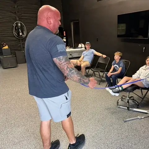 A trainer talking owners through a session in the training room